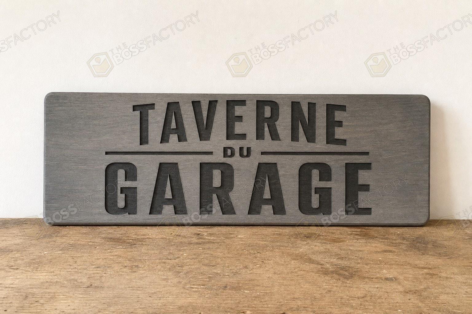 Workshop sign hung in a garage setting